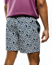 Mens Eddy All Over Print Swim Trunk in navy and white, featuring a relaxed fit, smooth quick-dry fabric, and an all-over geometric cube pattern with small Psycho Bunny skull logos. (2)
