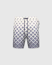 Mens Tobias Swim Trunk, cream with a navy blue gradient geometric pattern subtly integrating the Psycho Bunny skull logo, featuring a navy drawstring and logo zipper pull.