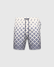 Mens Tobias Swim Trunk, cream with a navy blue gradient geometric pattern subtly integrating the Psycho Bunny skull logo, featuring a navy drawstring and logo zipper pull.