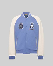 The MENS RYDER KNIT BOMBER - MO1100034 by Psycho Bunny is a light blue and white varsity jacket with white sleeves, blue cuffs and collar, plus embroidered bunny logo and "Beyond Bunny" text on the left chest.