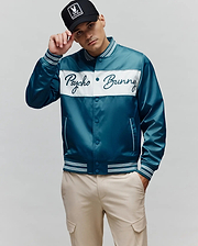 Mens Thomas Satin Bomber in teal with a white chest panel featuring an embroidered Psycho Bunny script logo, classic fit, and striped ribbed trim.