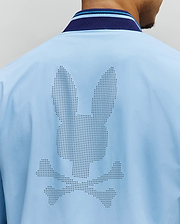 Mens Aldrin Bomber in sky blue, featuring a large perforated Psycho Bunny skull logo centered on the back. It has a smooth fabric and a navy and light blue striped ribbed collar. (4)