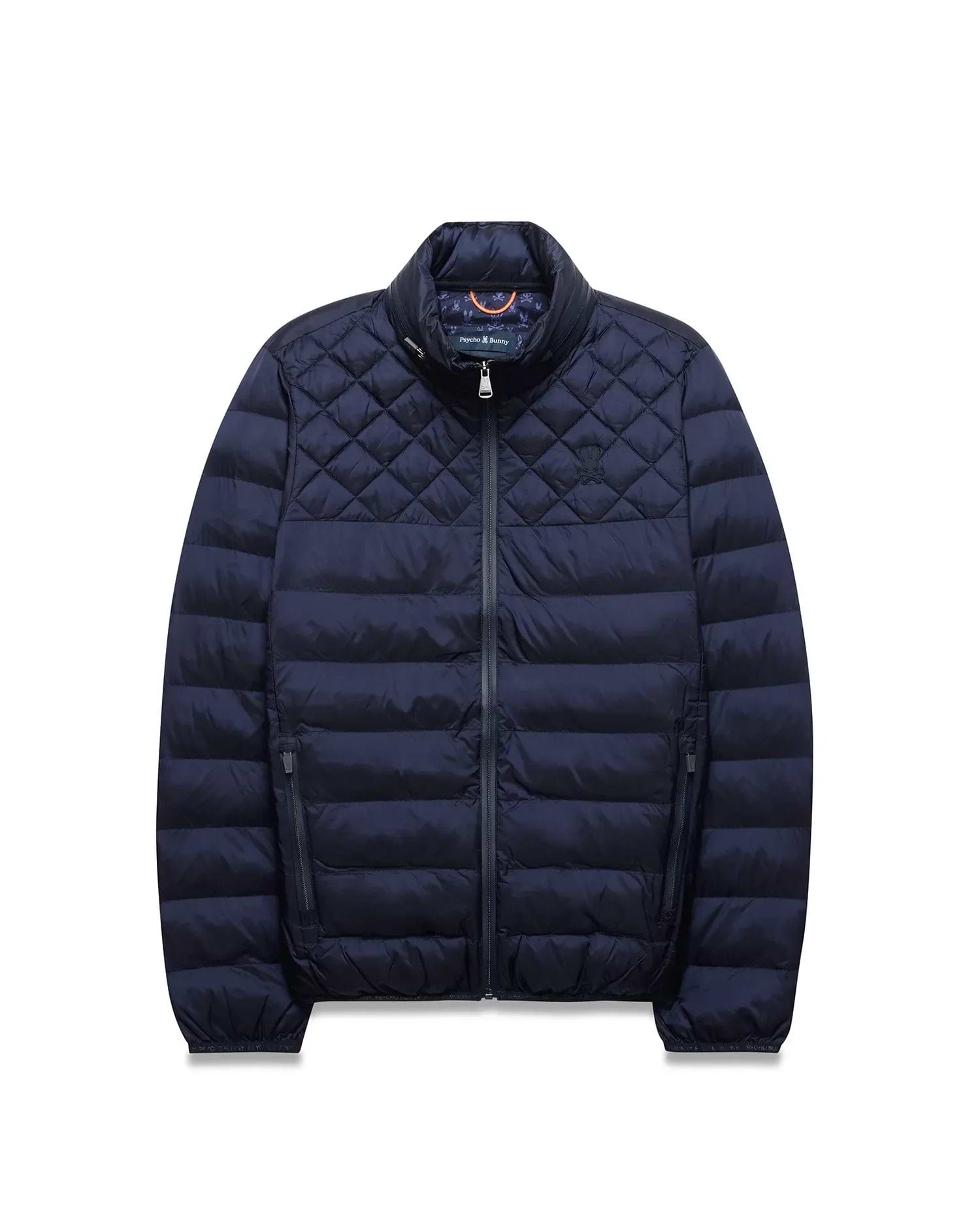 Navy Mens Emerik Puffer Jacket, quilted upper, horizontal baffles, stand collar, full zip, zippered pockets. Small embroidered Psycho Bunny skull on left chest, colorful patterned inner collar. (5)