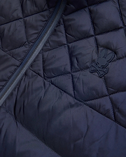 Mens Emerik Puffer Jacket, a navy quilted puffer jacket crafted from smooth nylon, featuring a dark zipper and a small, rubberized Psycho Bunny skull logo on the chest. (6)