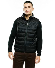 Mens Emerik Quilted Puffer Vest in black, featuring a classic fit, full-zip closure, stand collar, and a small embroidered Psycho Bunny skull logo on the left chest. The vest has a diamond quilted upper and horizontal quilted lower. (1)