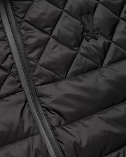 Mens Emerik Puffer Vest in black, featuring a quilted smooth nylon fabric, full-zip closure, and a small, tonal rubberized Psycho Bunny skull logo on the left chest. (6)