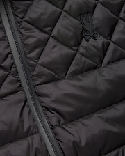 Mens Emerik Puffer Vest in black, featuring a quilted smooth nylon fabric, full-zip closure, and a small, tonal rubberized Psycho Bunny skull logo on the left chest. (6)