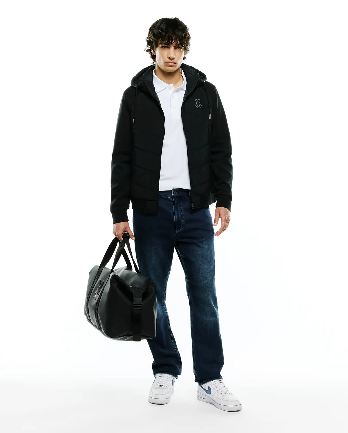 Black Mens Gordley Mix Media Jacket, a hooded full-zip with quilted body panels, smooth sleeves, and a small embroidered Psycho Bunny skull logo on the left chest.