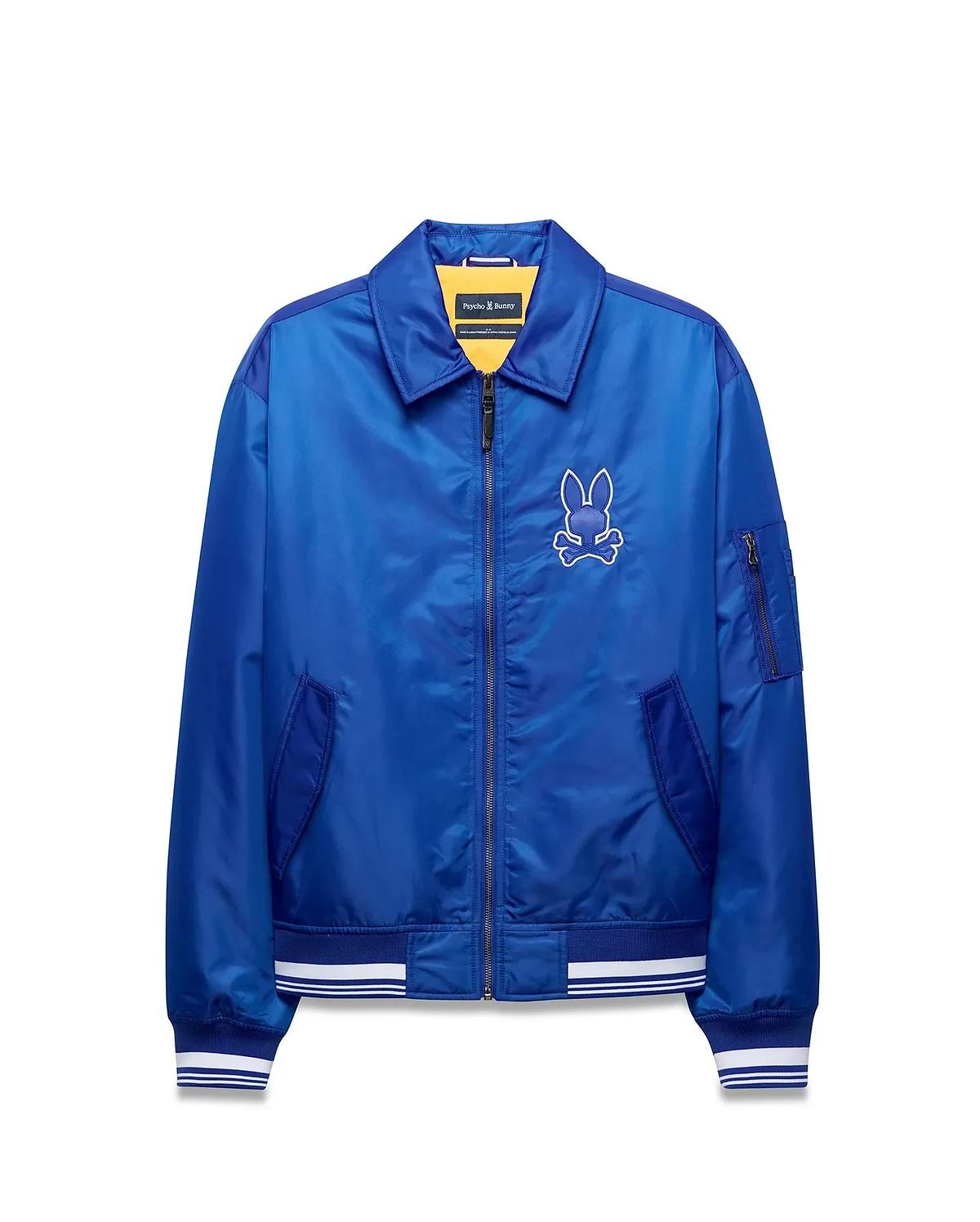 Mens Nathaniel Satin Coach Jacket, royal blue satin, full-zip, ribbed cuffs/hem with white stripes, zippered sleeve pocket, and large white embroidered Psycho Bunny skull logo on left chest. (6)