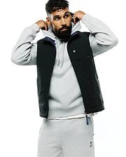 Mens Gordler Reversible Vest, a classic fit black vest with a smooth finish, featuring a navy interior, full zip, snap-button chest pockets, and a Psycho Bunny text label on the chest with a branded zipper pull.