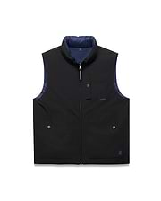 Mens Gordler Reversible Vest in black smooth fabric with a navy blue interior, featuring a full zip, stand collar, chest pocket, two lower snap pockets, and a blue embroidered Psycho Bunny skull logo.