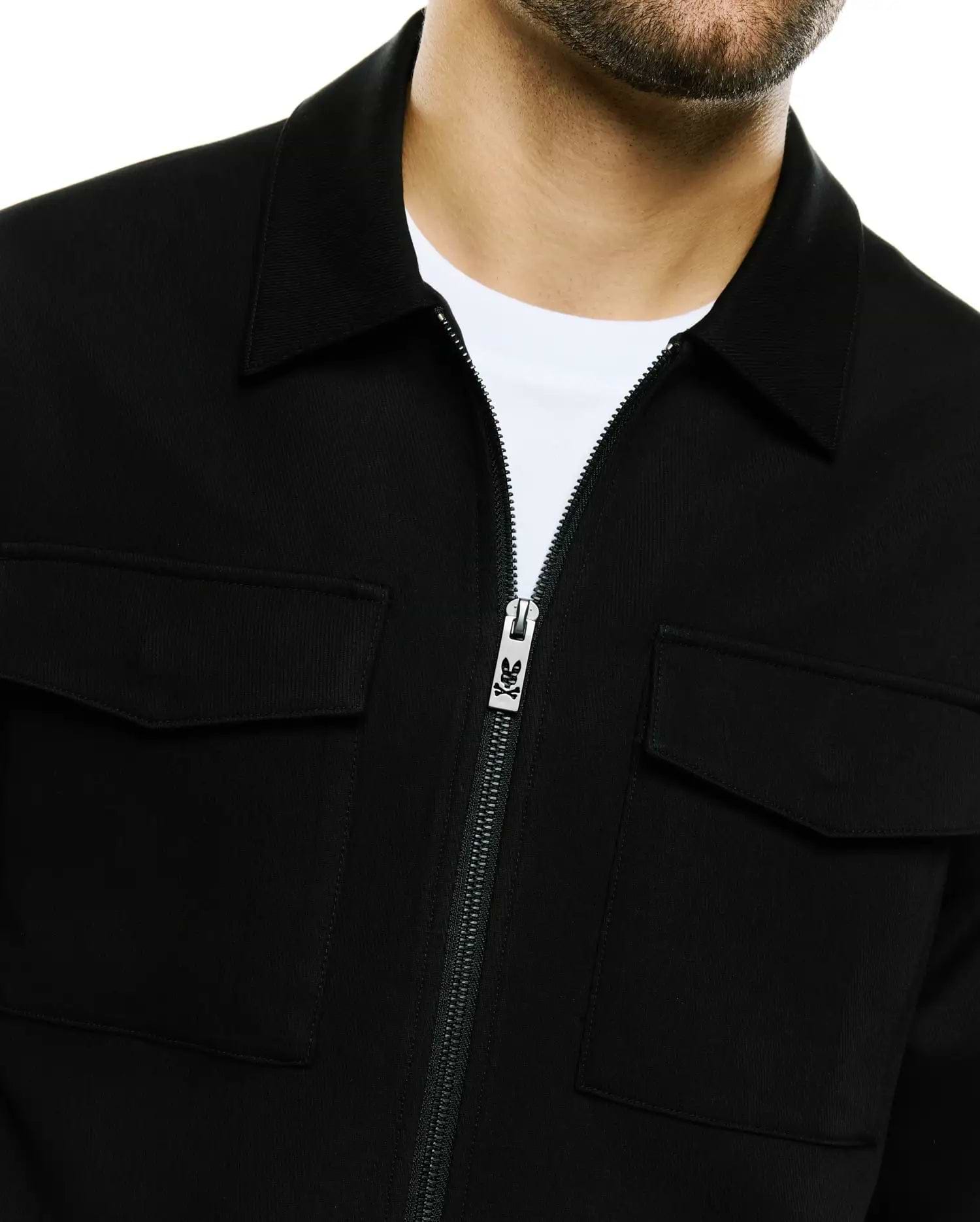 Men's Wayde Twill Overshirt in black, featuring a classic collar, full-zip front with a silver Psycho Bunny skull logo zipper pull, and two chest flap pockets, crafted from textured twill fabric for a relaxed fit. (2)