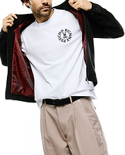 Men's Wayde Twill Overshirt in black, featuring a full zip, buttoned cuffs, and a vibrant red patterned lining. Layered over a white jersey t-shirt with a large central black Psycho Bunny skull logo. (3)