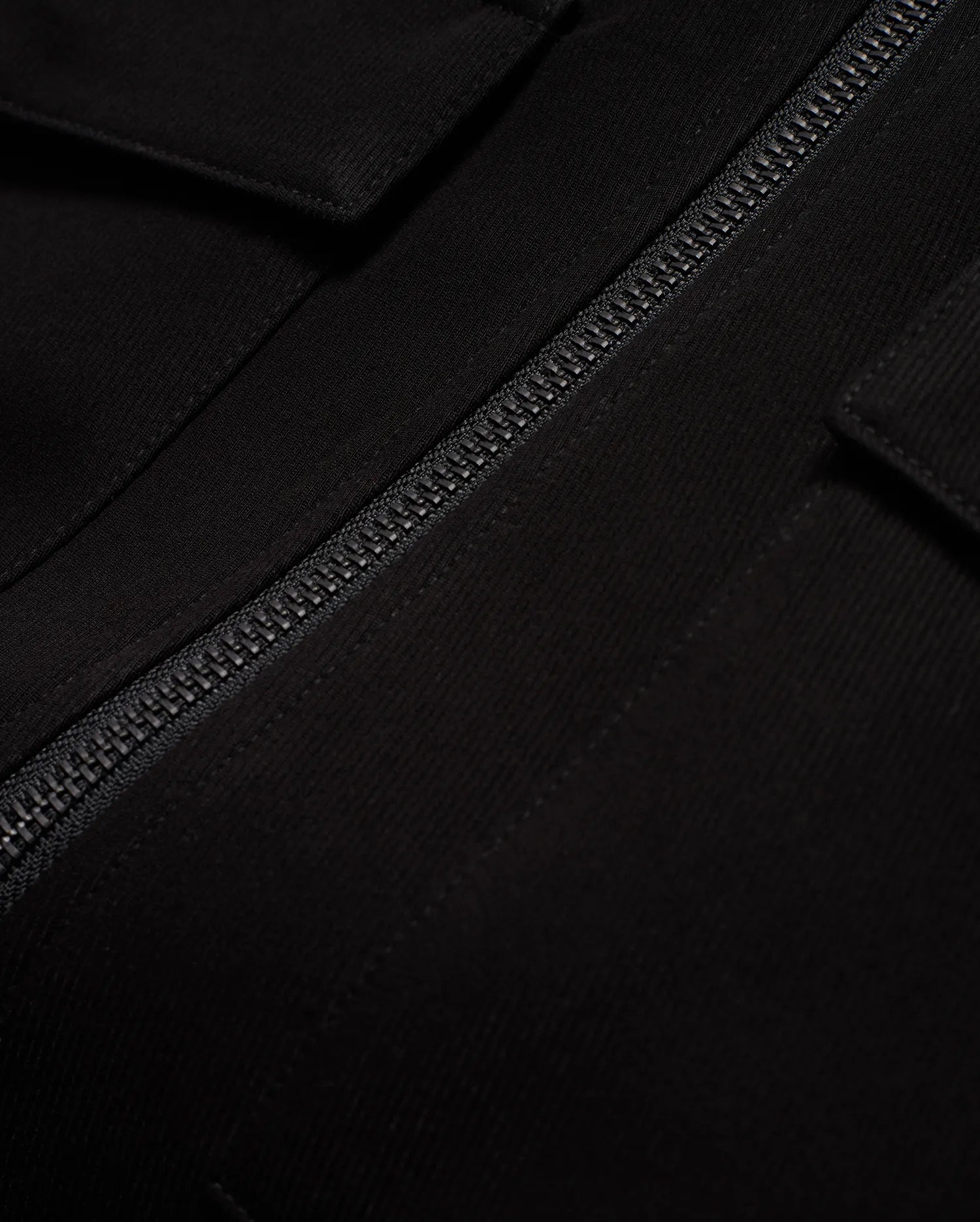 Men's Wayde Twill Overshirt, a premium black twill overshirt with a relaxed fit, featuring a prominent black zipper and a subtle flap pocket detail. (6)