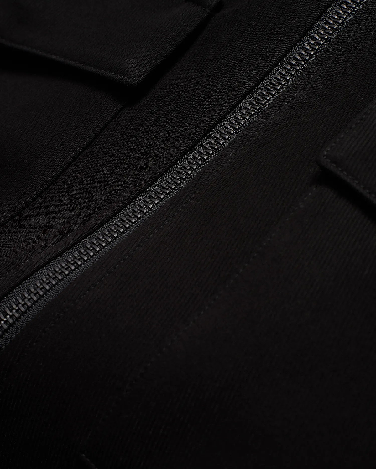 Men's Wayde Twill Overshirt, a premium black twill overshirt with a relaxed fit, featuring a prominent black zipper and a subtle flap pocket detail. (6)