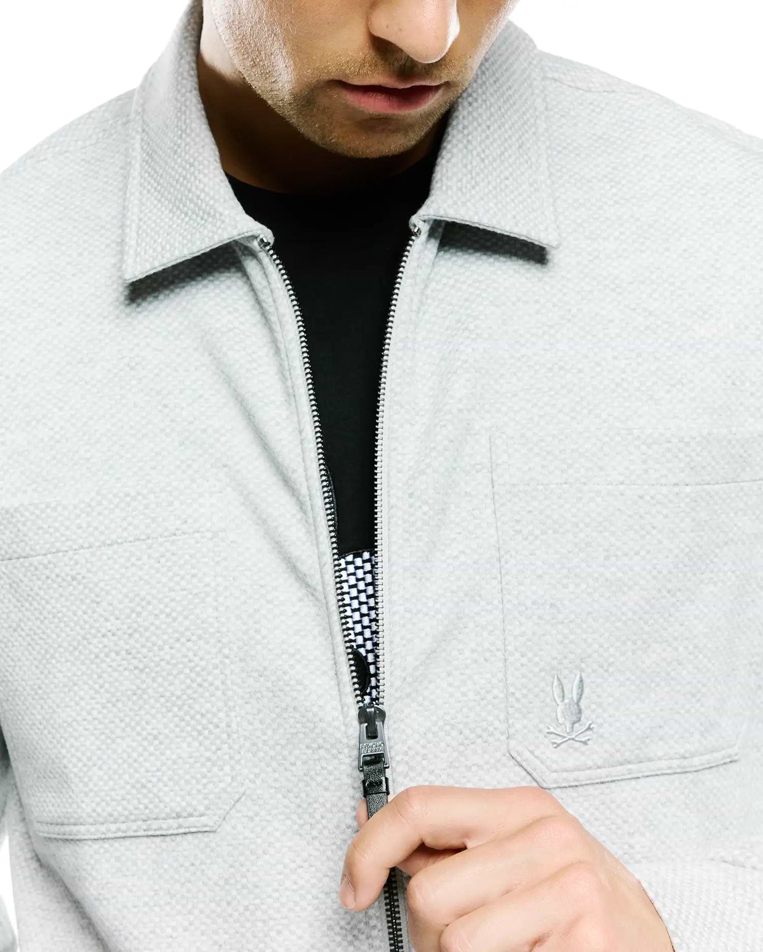 Light grey Mens Marc Textured Overshirt, classic fit, featuring a full-zip closure with branded pull, small embroidered Psycho Bunny skull logo on the right chest, and a black/white checkered zipper lining.