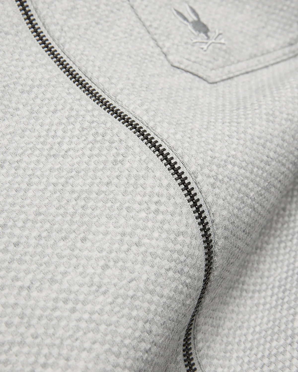 Mens Marc Textured Overshirt in light grey, featuring a subtle textured knit, dark grey full-zip, and a small embroidered Psycho Bunny skull logo on the chest pocket.