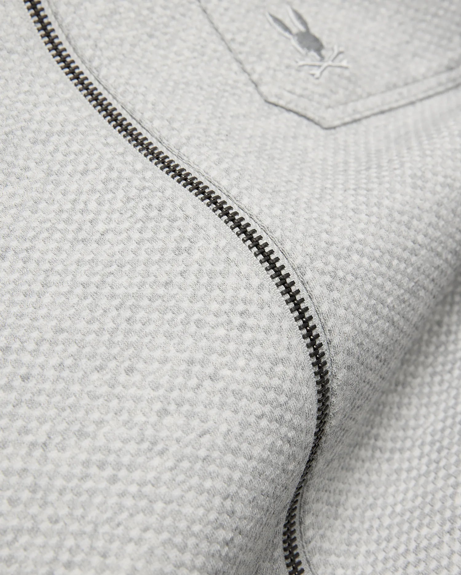 Mens Marc Textured Overshirt in light grey, featuring a subtle textured knit, dark grey full-zip, and a small embroidered Psycho Bunny skull logo on the chest pocket.