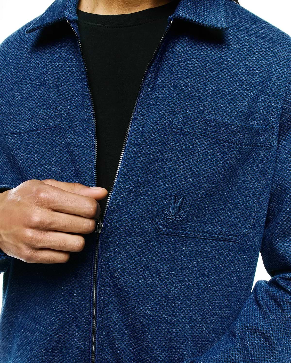 Mens Marc Textured Overshirt, a deep blue full-zip overshirt with a relaxed fit, classic collar, visible pique knit texture, and a small embroidered Psycho Bunny skull logo on the left chest pocket.