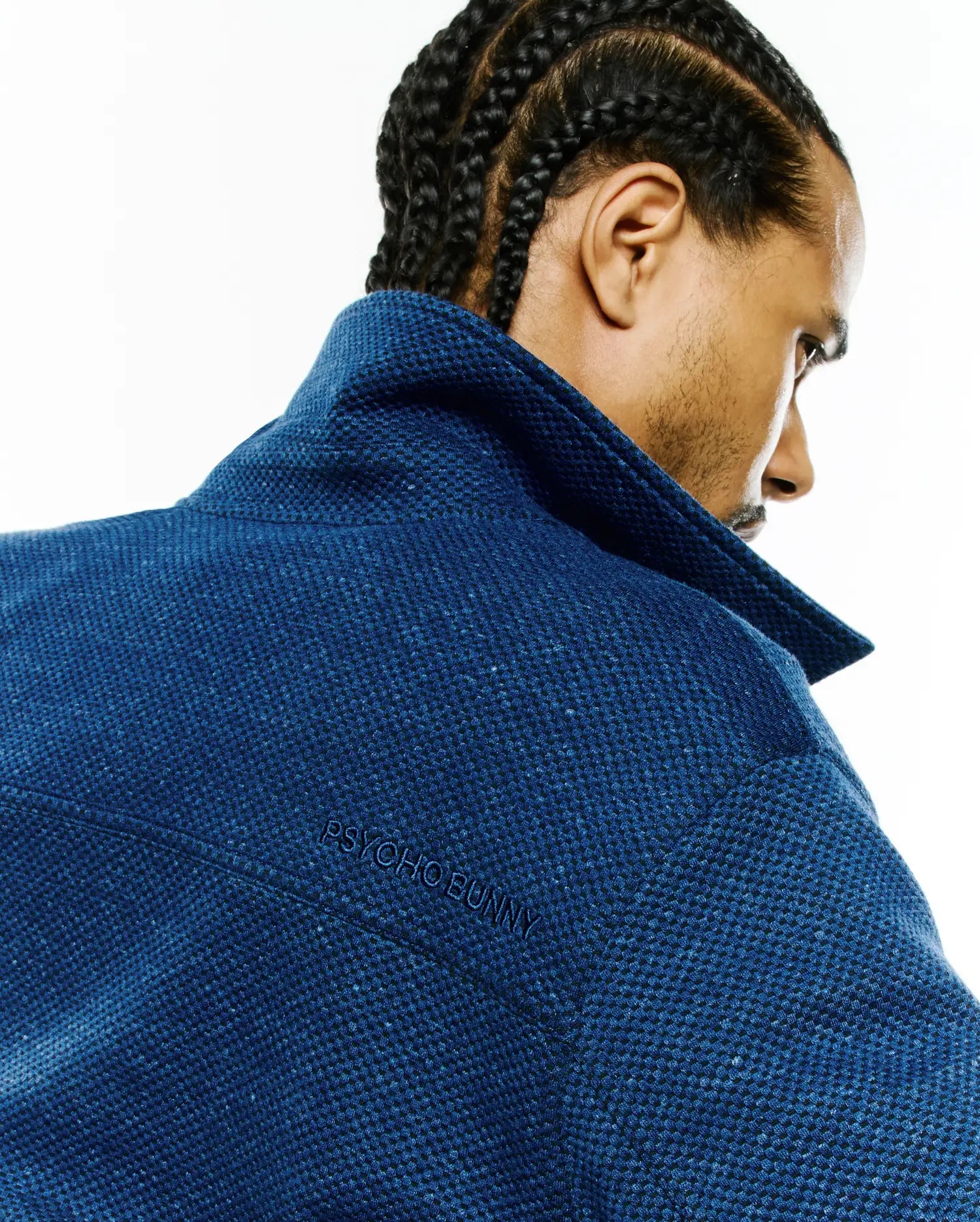 Mens Marc Textured Overshirt, a classic fit deep blue overshirt with a prominent pique-like texture and subtle embroidered PSYCHO BUNNY branding on the upper back.