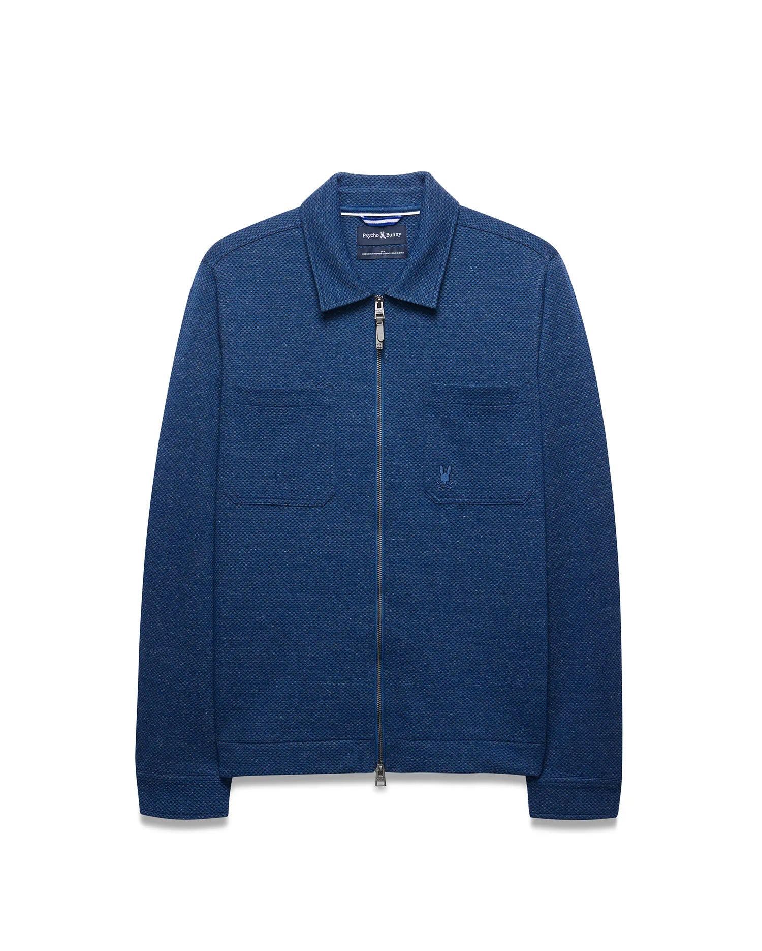 Mens Marc Textured Overshirt in deep indigo blue, featuring a full-zip front, classic collar, two chest patch pockets, and a small embroidered Psycho Bunny skull logo on the left chest.