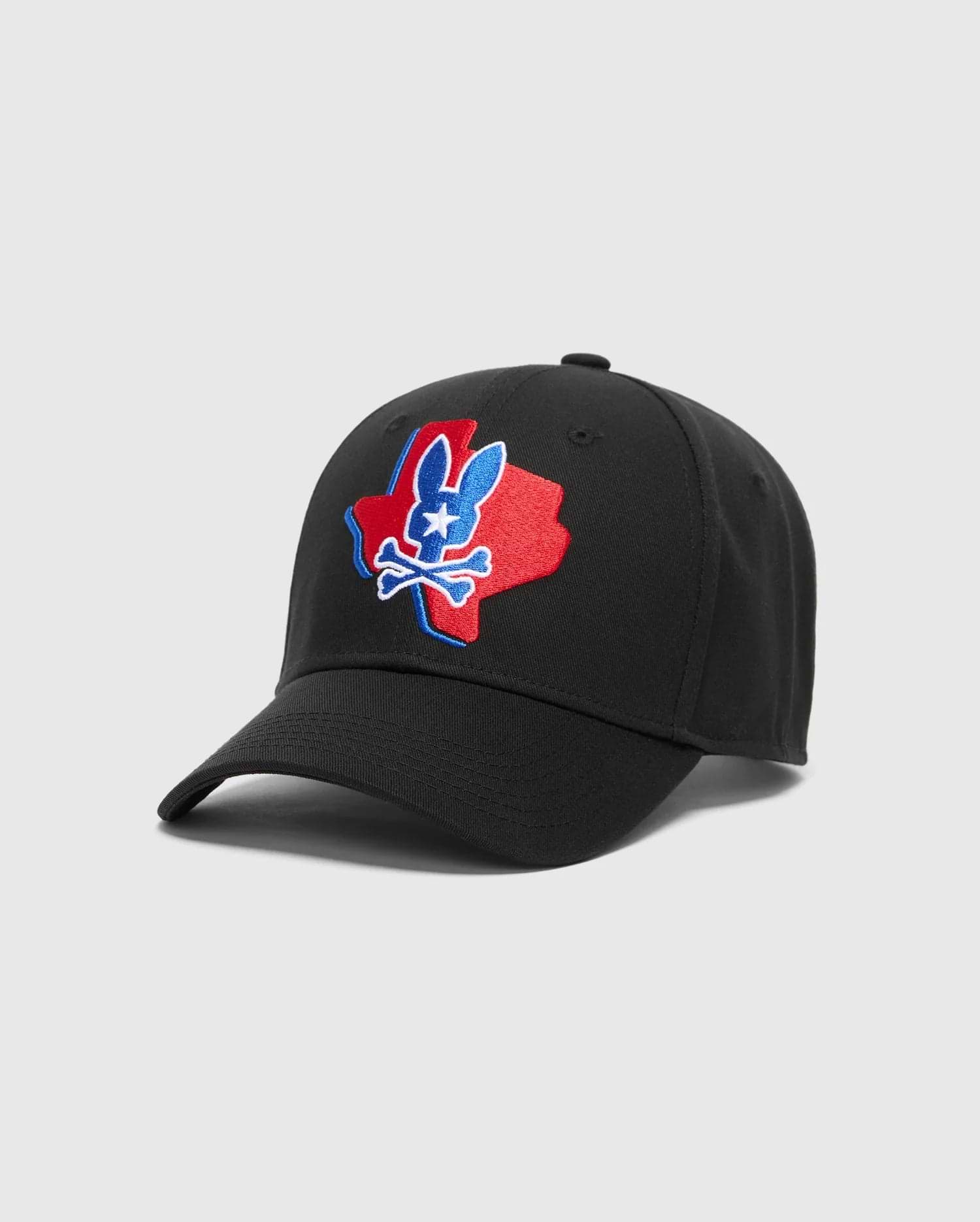 The Psycho Bunny Men's Texas Baseball Cap (MO1500014) is crafted from woven cotton with a colorful embroidered Texas silhouette and bunny skull logo in red, white, and blue. It features a curved brim and an adjustable back strap. (2)