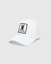 White Mens Adamo Trucker Cap featuring a large, centered black embroidered Psycho Bunny skull and crossbones logo patch with PSYCHO BUNNY text on the solid front panel and a breathable mesh back.