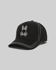 Mens Oscar Trucker Cap in black structured cotton twill, featuring a prominent white embroidered Psycho Bunny skull logo on the front and contrasting white stitching details throughout. (2)