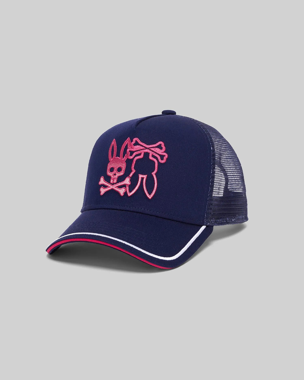 Mens Aram Trucker Cap in navy with a large hot pink embroidered Psycho Bunny skull logo on the front, mesh back, and a brim featuring hot pink and white stripes. (2)