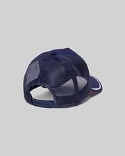 Mens Aram Trucker Cap in navy blue, featuring breathable mesh back panels, an adjustable snapback closure, and a brim with a white stripe and red underside. (4)