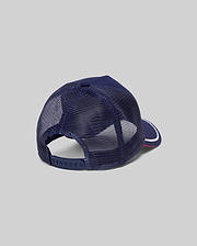 Mens Aram Trucker Cap in navy blue, featuring breathable mesh back panels, an adjustable snapback closure, and a brim with a white stripe and red underside. (4)