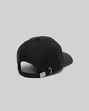 Black Mens Jimmy Baseball Cap with a smooth twill texture, featuring an adjustable strap and a small metallic Psycho Bunny skull logo on the silver buckle at the back.