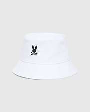 Mens Jimmy Bucket Hat in crisp white cotton twill, featuring a prominent black embroidered Psycho Bunny skull logo centered on the front, with subtle ventilation eyelets.