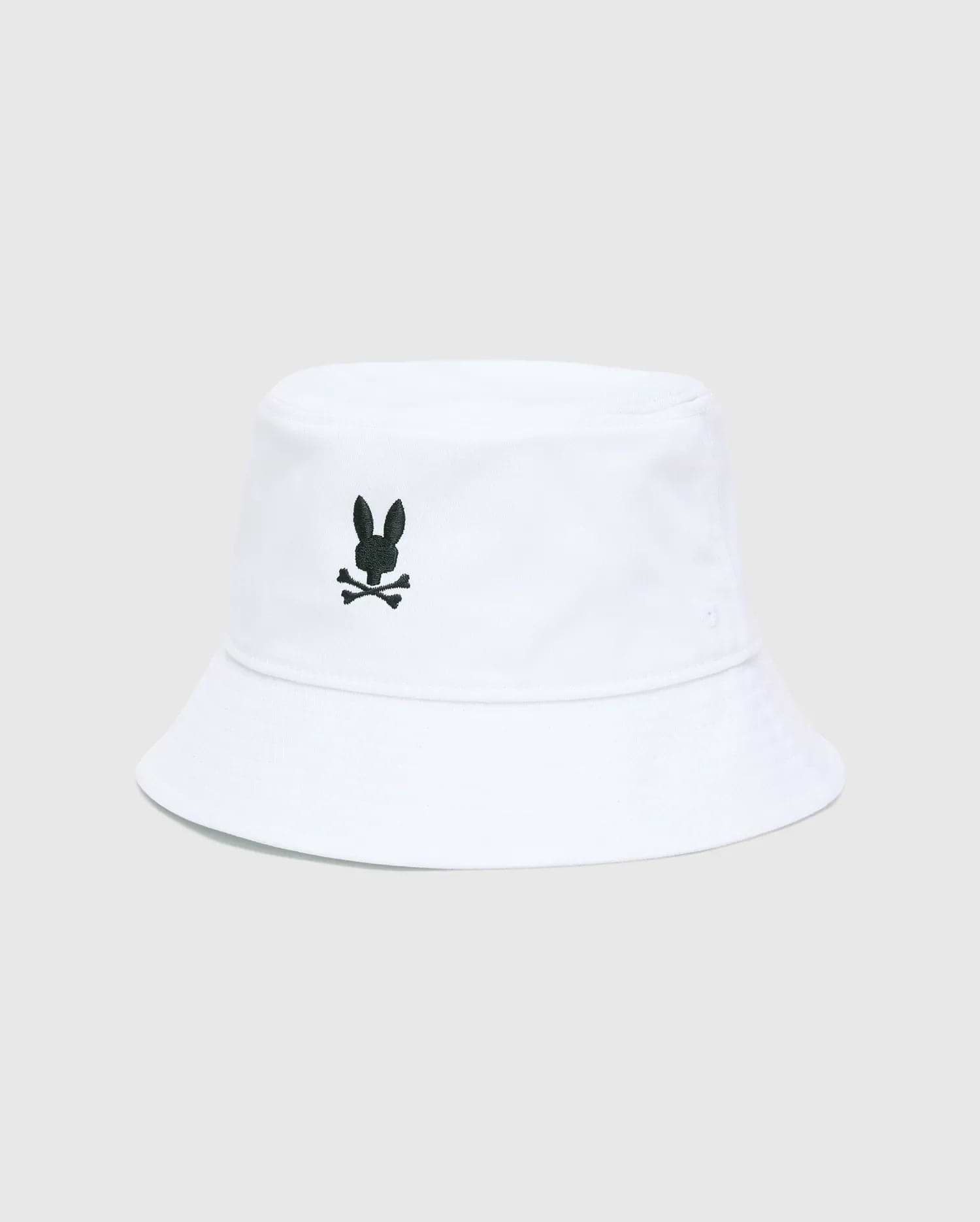 Mens Jimmy Bucket Hat in crisp white cotton twill, featuring a prominent black embroidered Psycho Bunny skull logo centered on the front, with subtle ventilation eyelets.