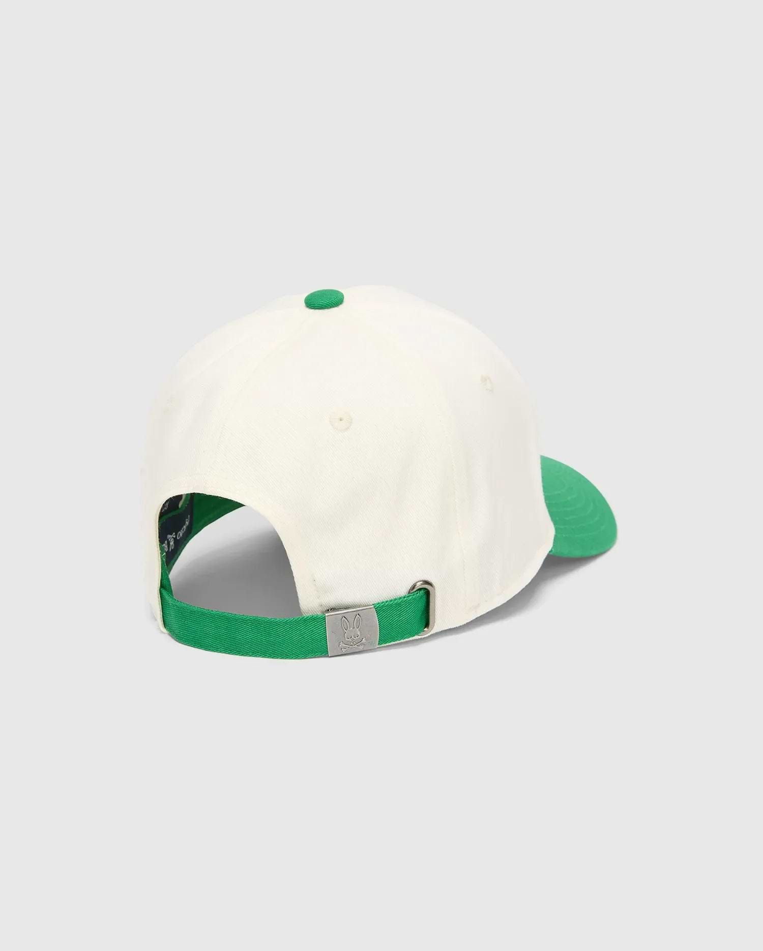 Mens Craig Baseball Cap in cream with a vibrant green brim, top button, and adjustable strap. The back features a silver metal buckle embossed with the iconic Psycho Bunny skull logo.