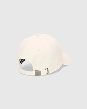 Mens Hubert Baseball Cap in cream textured fabric, featuring an adjustable back strap with a gunmetal buckle embossed with the small Psycho Bunny skull logo and a dark inner band.