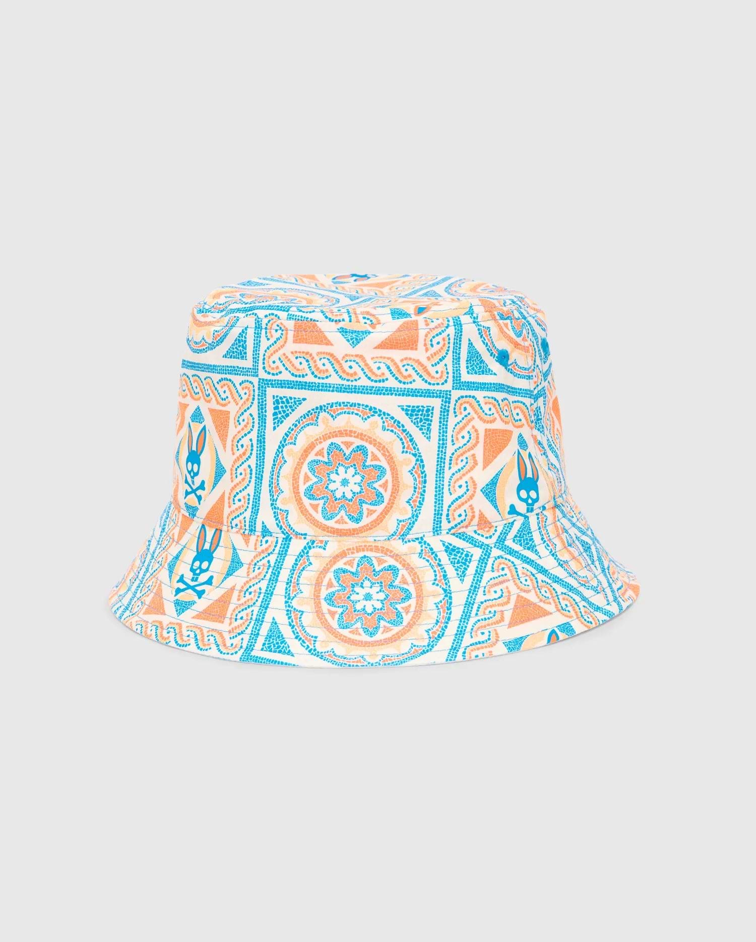 Mens Frank Reversible Bucket Hat featuring a vibrant white, blue, and orange mosaic pattern with repeated Psycho Bunny skull logos integrated throughout the design.