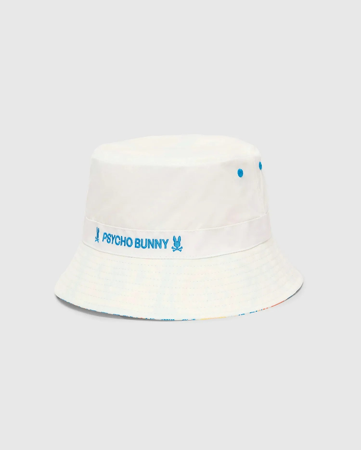 Mens Frank Reversible Bucket Hat, white with blue embroidered Psycho Bunny text and skull logos on a band, blue eyelets, and a subtle multicolor reversible brim.