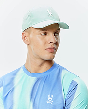 Mens Blaze Sport Cap in light mint green with perforated sides and a white Psycho Bunny logo, paired with a blue and aqua tie-dye performance t-shirt featuring a small white Psycho Bunny logo on the left chest. (1)