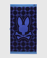 All Over Bunny Towel in navy terry cloth, featuring a large central royal blue bunny skull logo and an all-over smaller bunny skull pattern, with light blue striped borders. (2)