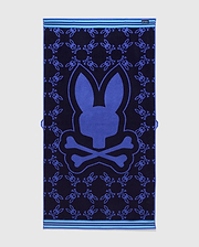 All Over Bunny Towel in navy terry cloth, featuring a large central royal blue bunny skull logo and an all-over smaller bunny skull pattern, with light blue striped borders. (2)