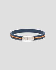 Mens Link Rubber Bracelet in navy blue rubber with an embedded orange chain detail, featuring a silver-toned metal clasp engraved with the Psycho Bunny skull logo and text. (1)