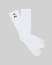 Mens New Classic Sport Sock, crisp white athletic crew socks featuring a ribbed cuff and a small, iconic black embroidered Psycho Bunny skull logo on the outer ankle.