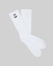 Mens New Classic Sport Sock, crisp white athletic crew socks featuring a ribbed cuff and a small, iconic black embroidered Psycho Bunny skull logo on the outer ankle.