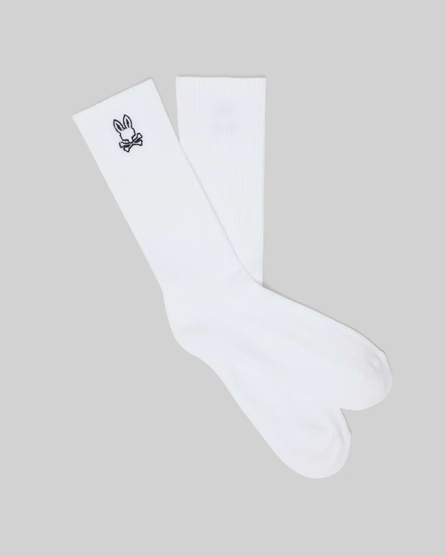 Mens New Classic Sport Sock, crisp white athletic crew socks featuring a ribbed cuff and a small, iconic black embroidered Psycho Bunny skull logo on the outer ankle.