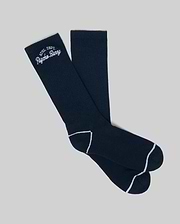 The MENS SCPRIT SOCKS - MO2200035 by Psycho Bunny are navy blue crew socks in soft Pima cotton, featuring white toe and heel trim and an "ATH DEPT. Psycho Bunny" embroidered logo. Shown flat on a light gray background. (1)