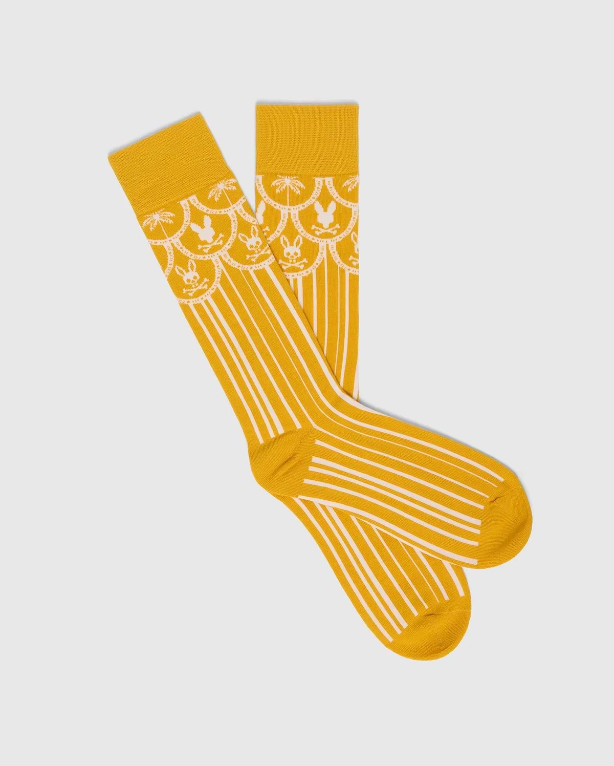 Mens Brad Dress Sock in vibrant yellow with white vertical stripes and a scalloped cuff featuring white palm trees and Psycho Bunny skull logos. (1)