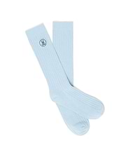 Light blue Mens Nathaniel Dress Sock, featuring a fine ribbed knit texture and a small, embroidered dark blue Psycho Bunny skull logo on the outer cuff. (1)