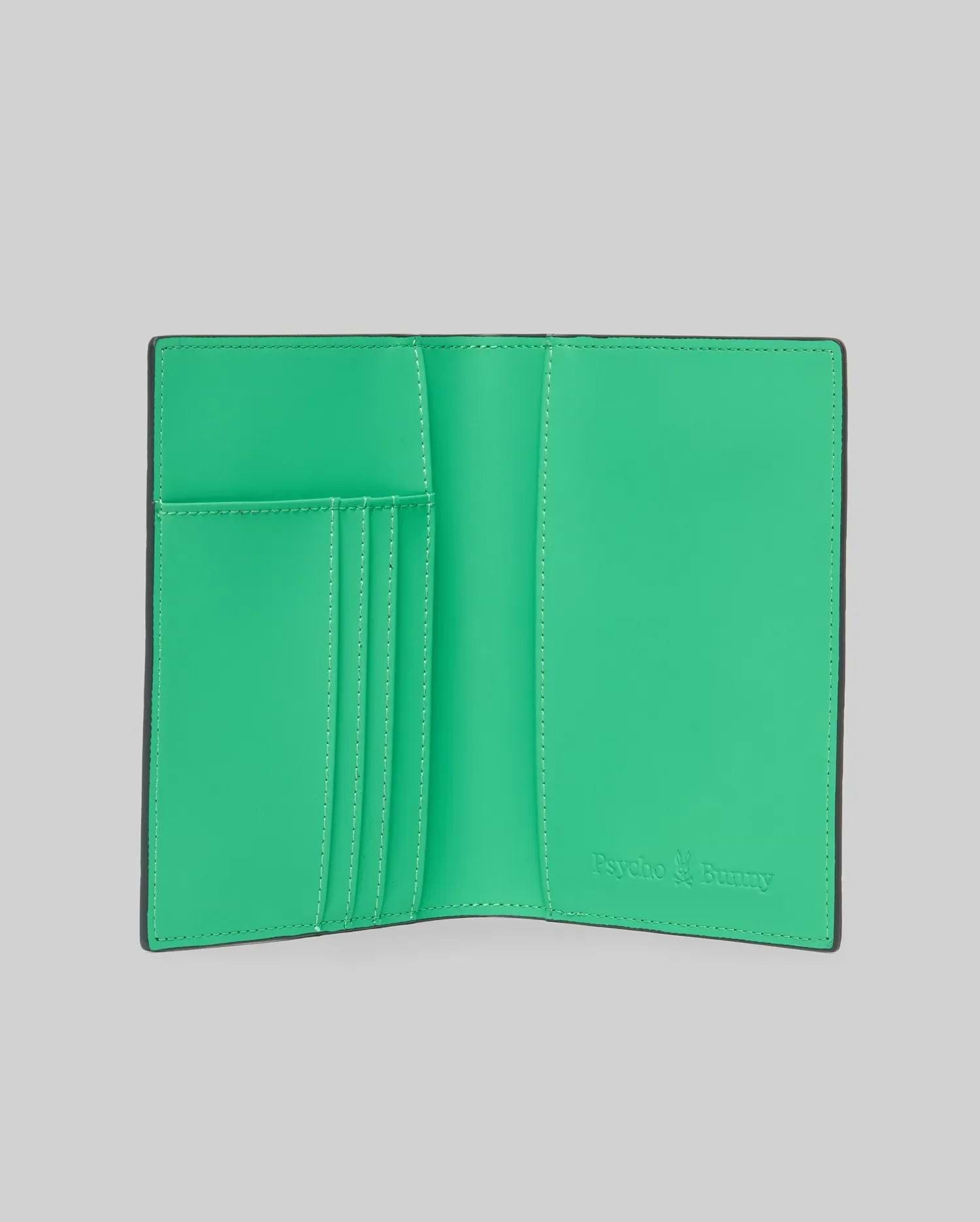 Passport Holder with a vibrant green interior and black exterior, featuring multiple card slots with white stitching and an embossed Psycho Bunny logo on the bottom right. (3)