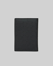 Black Passport Holder, a premium accessory featuring a subtle yet striking all-over embossed Psycho Bunny skull logo pattern on its smooth, durable leather-like surface. (4)